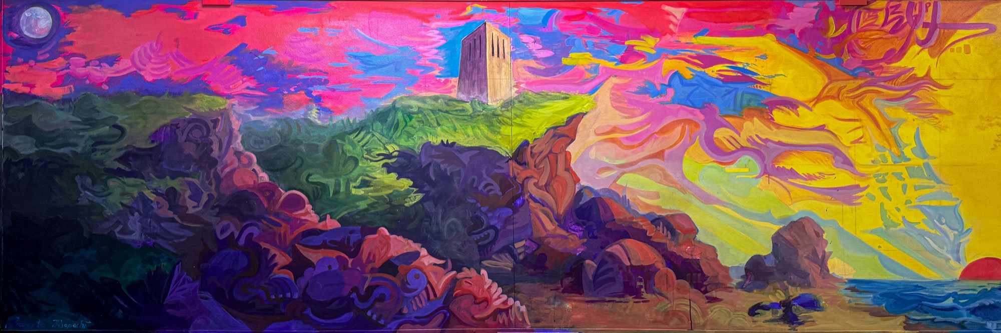 Surreal mural of California cliffs in saturated magenta, yellow and violet, with a tower on the ridge.